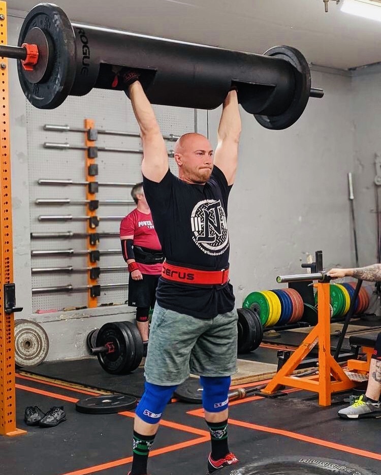 Joseph Milano pressing a 12" men's log