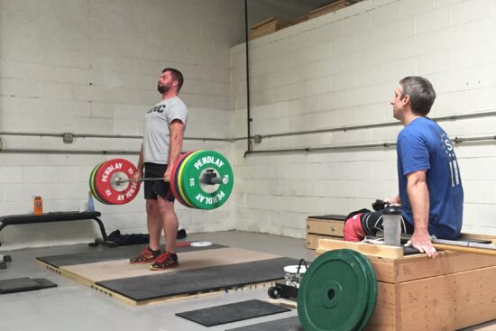 Brian coaching Justin on deadlifts